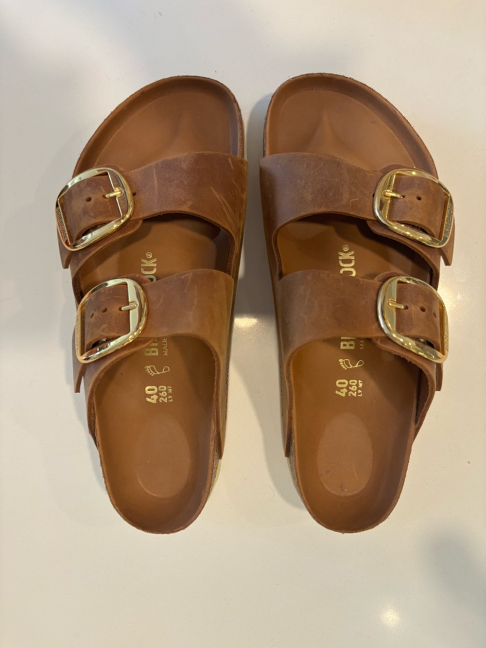 Birkenstock Arizona Two-Strap Sandals in Brown with Gold Buckles